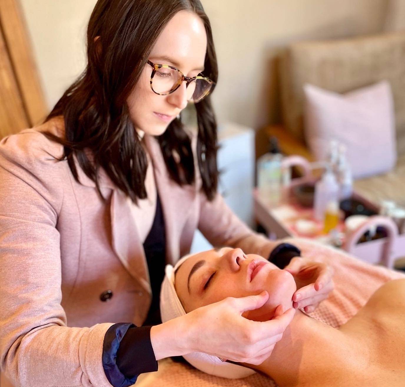 Estie Co's esthetician, Jules, providing a specialized acne skin consultation for a client.